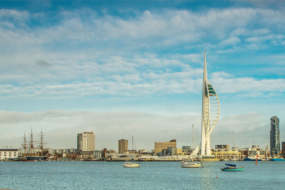 Things to do in Hampshire include visiting Portsmouth on a sunny summer day with the Spinnaker Tower overlooking Portsmouth Harbour.